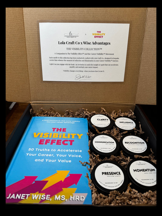 Box containing a book titled 'The Visibility Effect' by Janet Wise, a certificate, and small bottles labeled 'Momentin'.